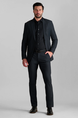 Full-length view of model wearing AIR Blazer – Heather Charcoal with one hand in a pocket for overall fit.