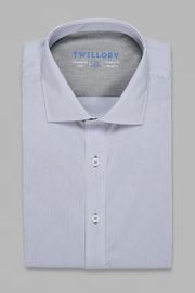 A neatly folded Twillory ADVANCER // Performance Grey Houndstooth shirt with a spread collar and two white buttons rests on a plain gray background. The brand name is printed in blue on the inside collar.
