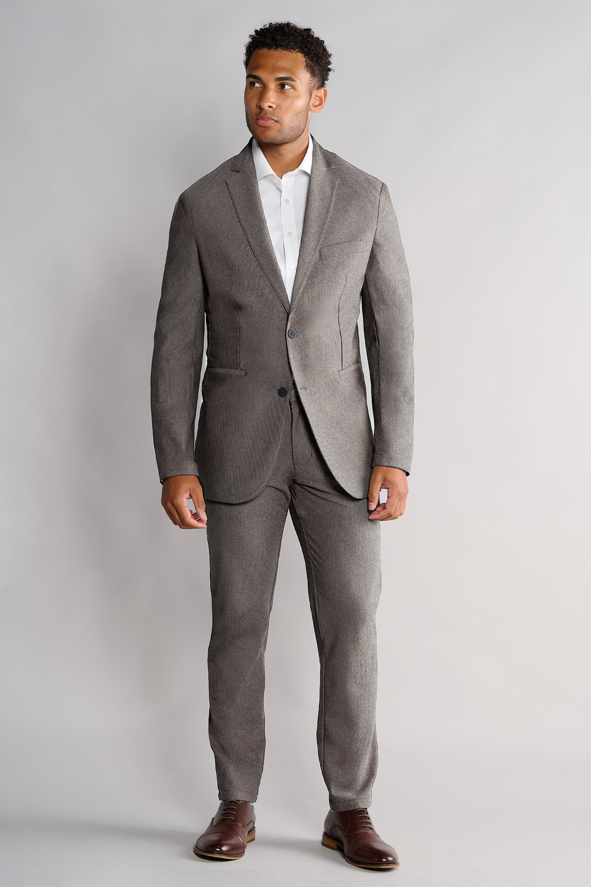 Half-body view of model wearing AIR Blazer – Heather Light Grey facing forward, front fit visible.