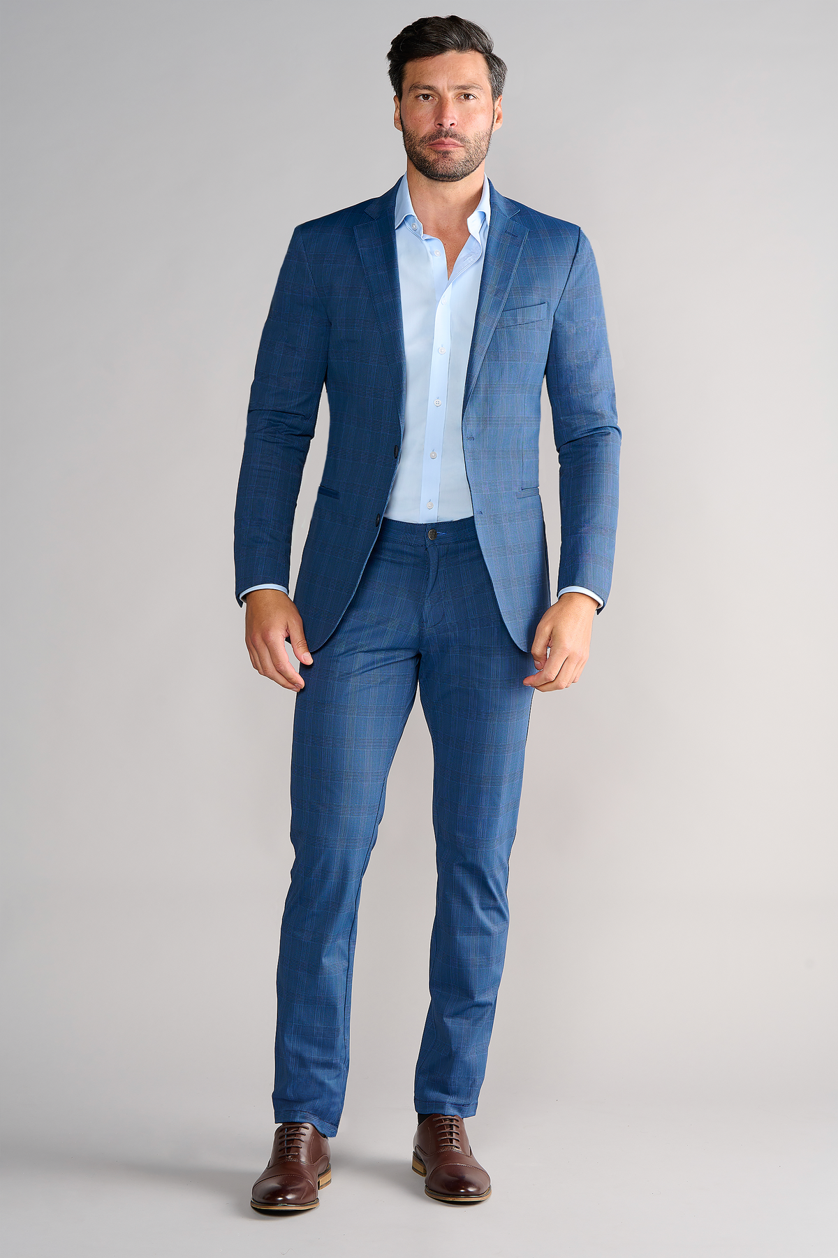 Full-length view of model wearing Performance Blazer – Blue Prince of Wales facing forward for overall fit.