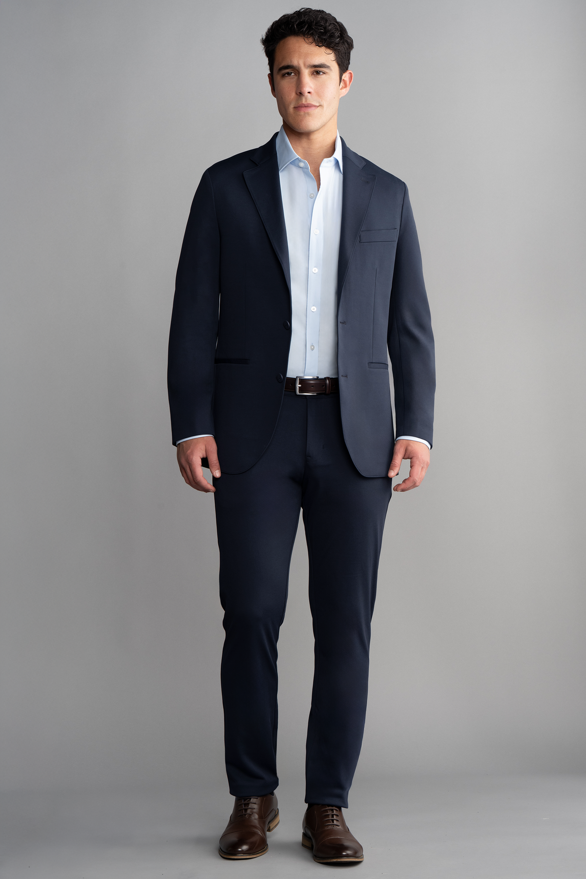 Full-length view of model wearing Circular Knit Blazer – Navy facing forward for overall fit.