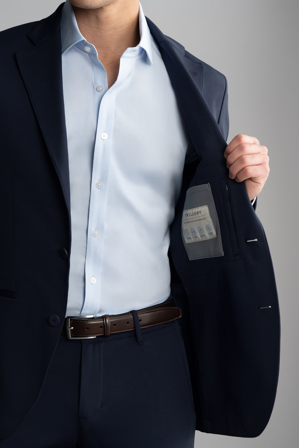 Torso view of model wearing Circular Knit Blazer – Navy, front fit and collar visible.