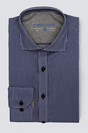 The Twillory Leader Check // Blue is a neatly folded long-sleeve shirt featuring a small black-and-white check pattern, dark buttons, and a gray inside collar with blue branding. Made from 4-way stretch, moisture-wicking fabric, shown on a light gray background.