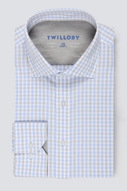 The Twillory Leader Check // Grey Blue Tattersall is a men’s long-sleeve dress shirt with a grey-blue check pattern, classic collar, white buttons, inner collar Twillory branding, and smooth moisture-wicking performance fabric.