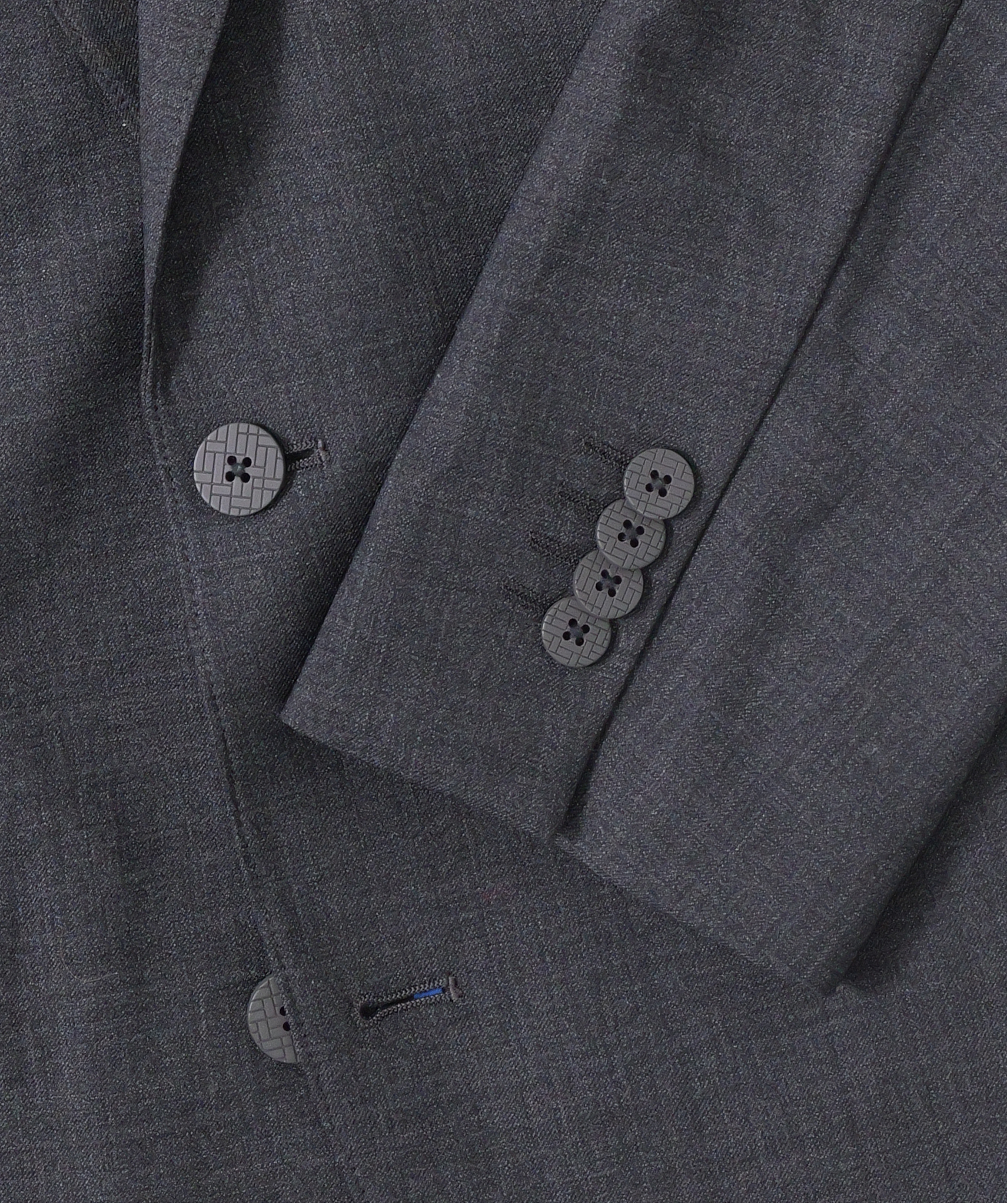 Close-up of the Twillory Hybrid Wool Blazer // Grey Heather, highlighting the sleeve with four black buttons overlapping the front, and two textured black buttons on smooth, finely woven, 4-way stretch fabric.