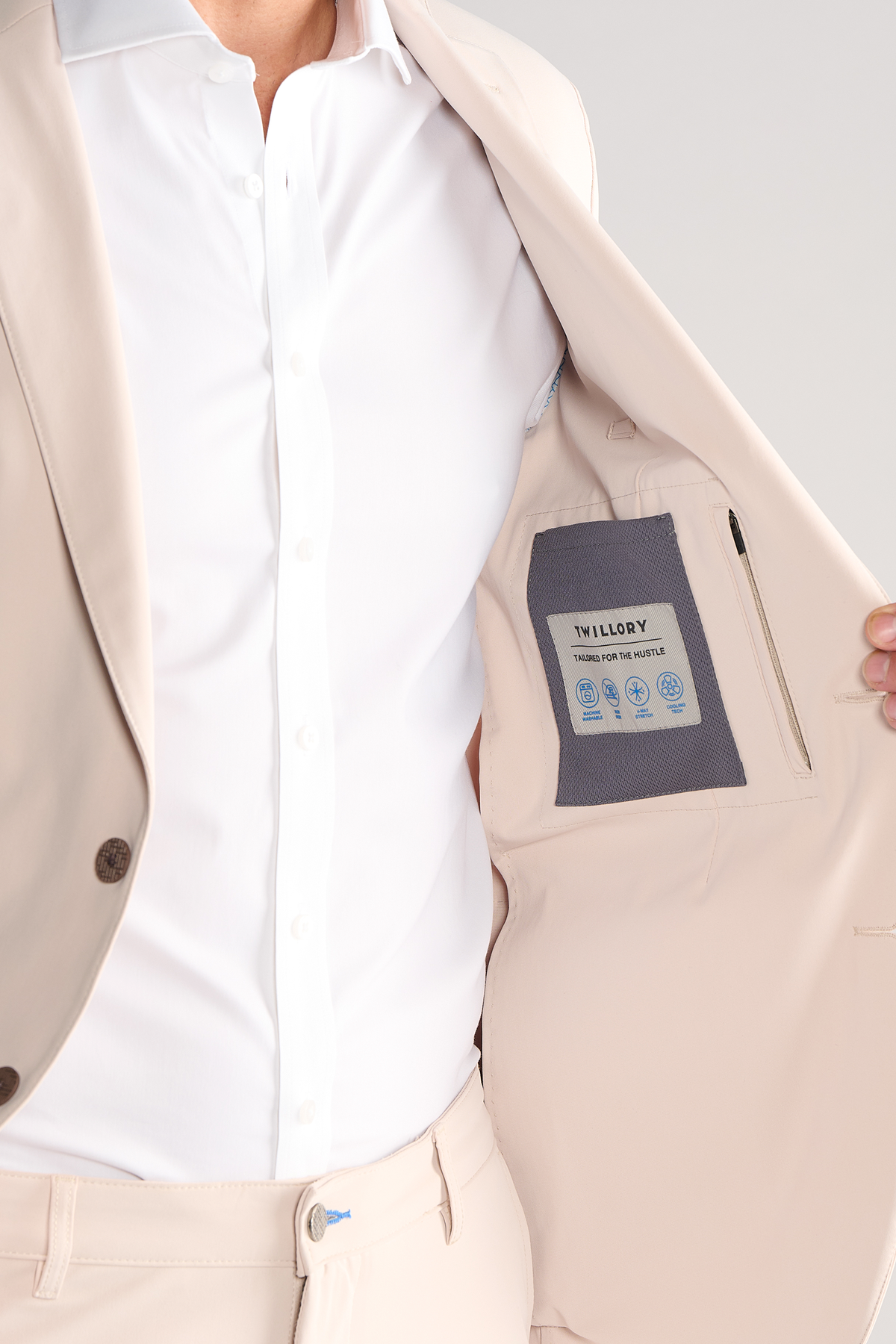 Model wearing Performance Blazer – Bone, front fit visible.