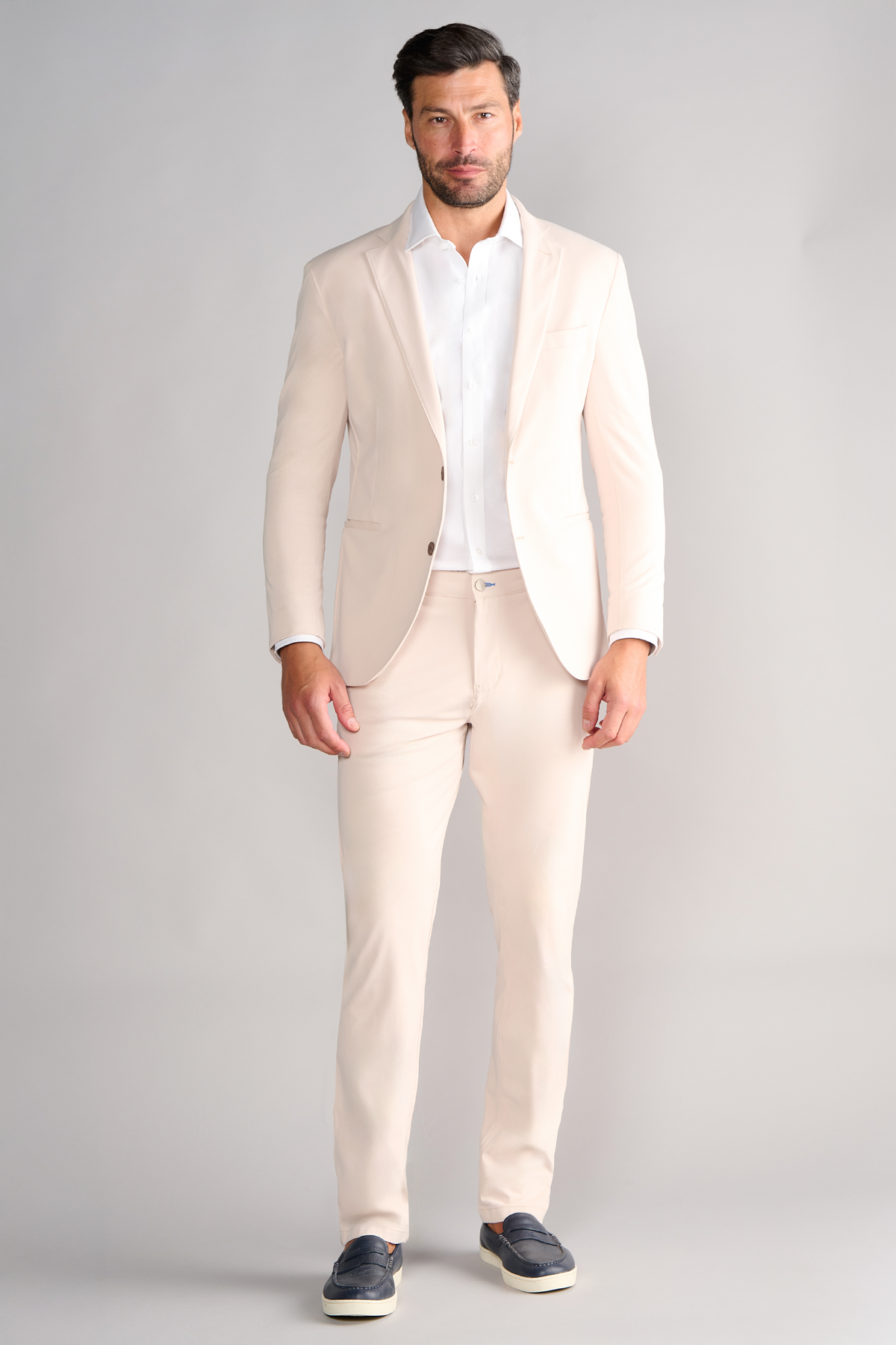 Full-length view of model wearing Performance Blazer – Bone facing forward for overall fit.