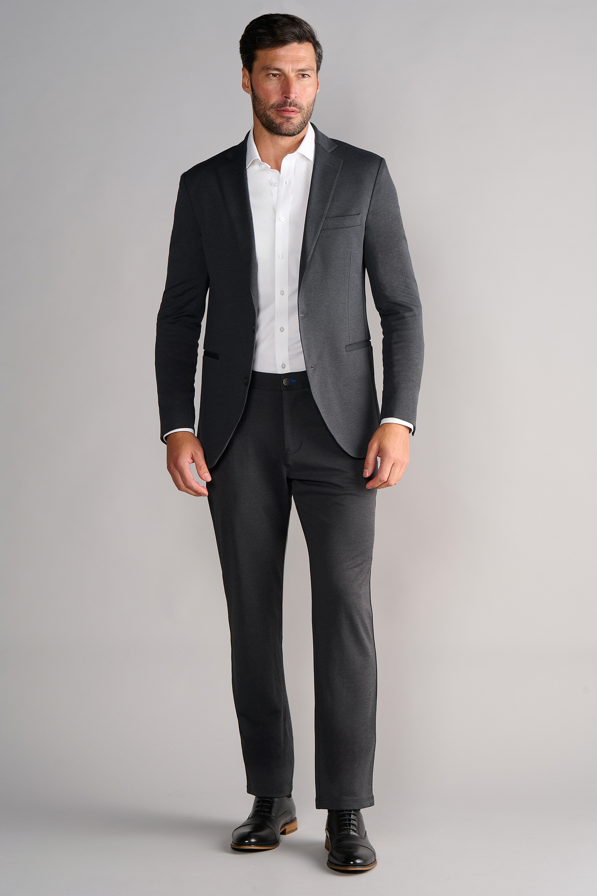 Full-length view of model wearing Circular Knit Blazer – Heather Grey for overall fit.