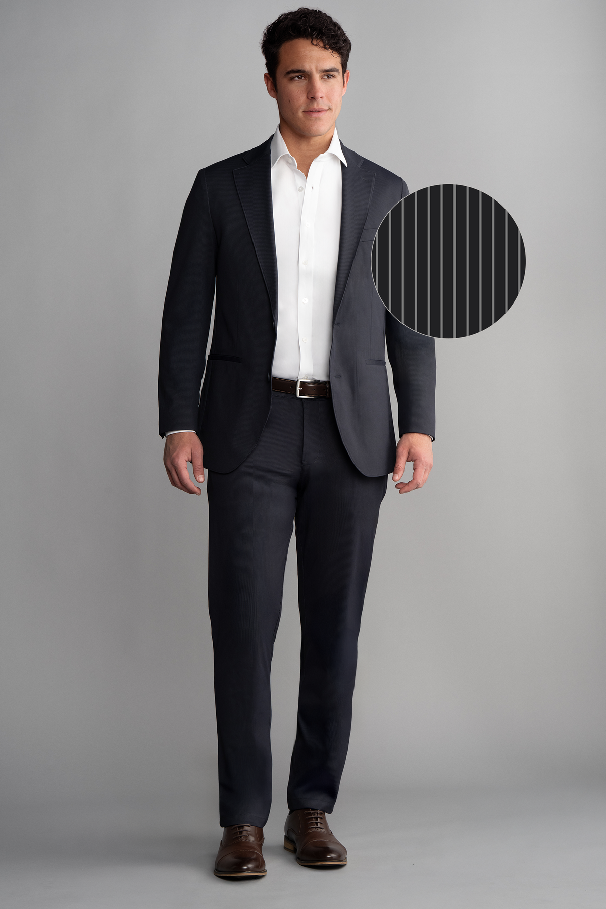 Full-length view of model wearing Performance Blazer – Navy Pin Stripe for overall fit.