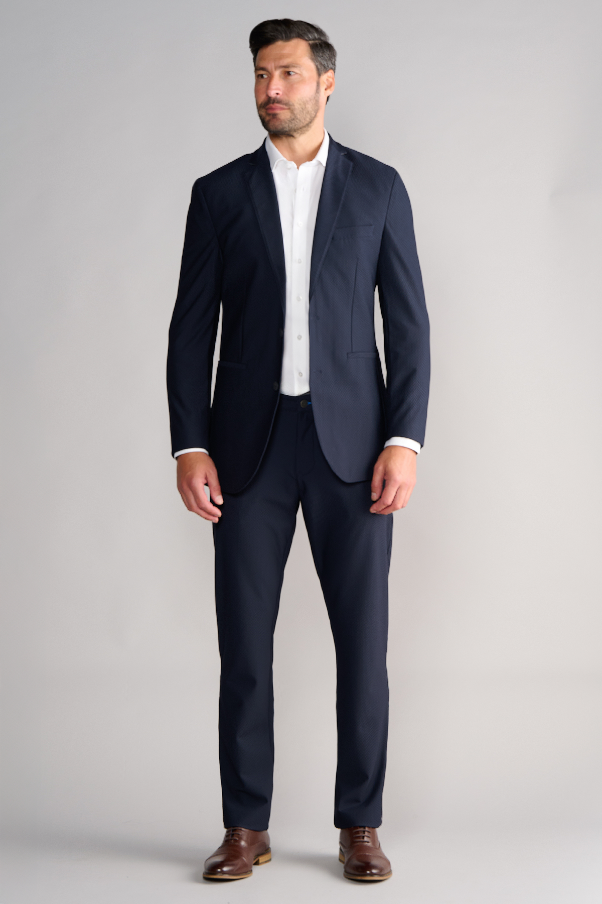 Full-length view of model wearing AIR Blazer – Navy facing forward for overall fit.
