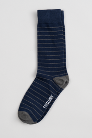 The Twillory Navy Stripe sock features thin light gray stripes, "TWILORY" in white by the toe, a ribbed cuff, and solid gray heel and toe sections—designed to become one of your favorites.