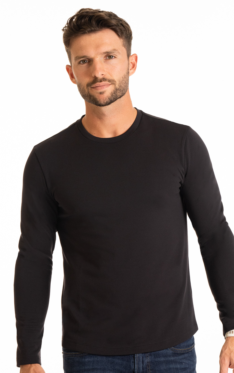 Male model wearing a black long-sleeve shirt with a casual expression against a white background.