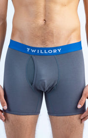 Close-up of a man wearing gray Twillory boxer briefs with a blue waistband.